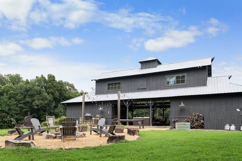 The back of the pavilion across mown lawn